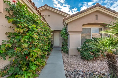 a front view of house with green space