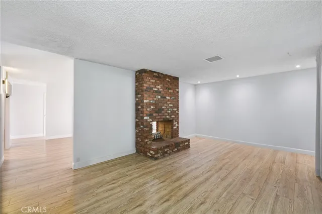 a view of a storage & utility room with wooden floor