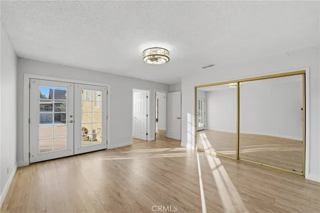 a view of patio with table and chairs and potted plants