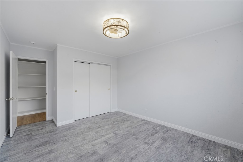 6255 Mitchell Avenue Riverside, CA 92505 - Photo 25 of 54 a view of a storage & utility room with wooden floor