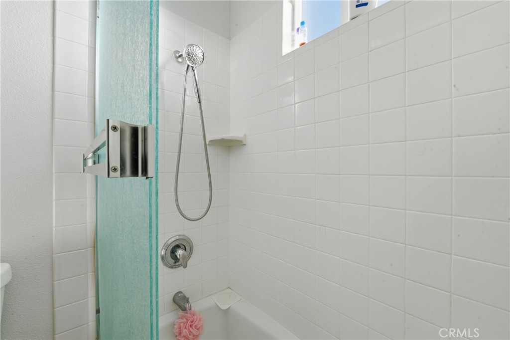 6255 Mitchell Avenue Riverside, CA 92505 - Photo 35 of 54 a bathroom with a glass shower door