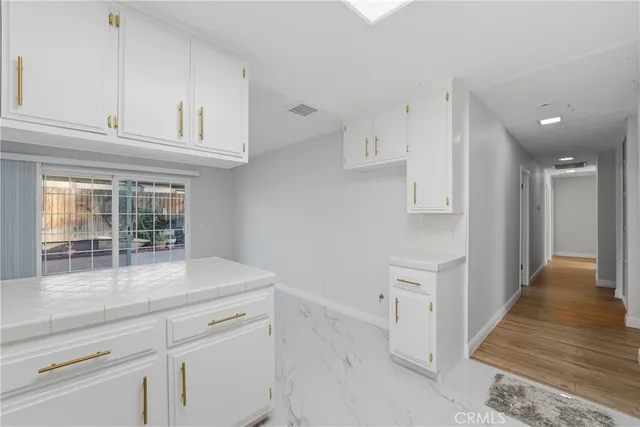 a room with a table and a fireplace