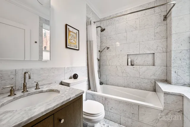 a kitchen with a sink cabinets and stainless steel appliances