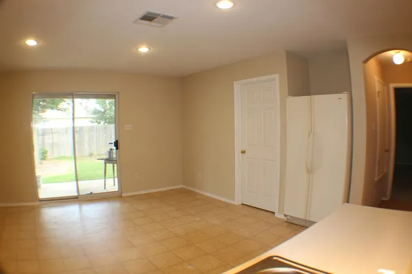 a view of an empty room and window