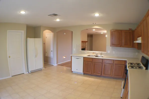 a large bathroom with a large mirror vanity and a sink