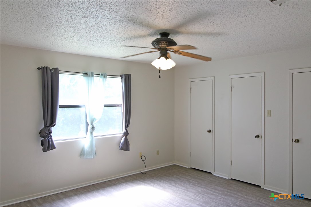 2406 Boyd Avenue Killeen, TX 76543 - Photo 15 of 22 wooden floor in an empty room with a window