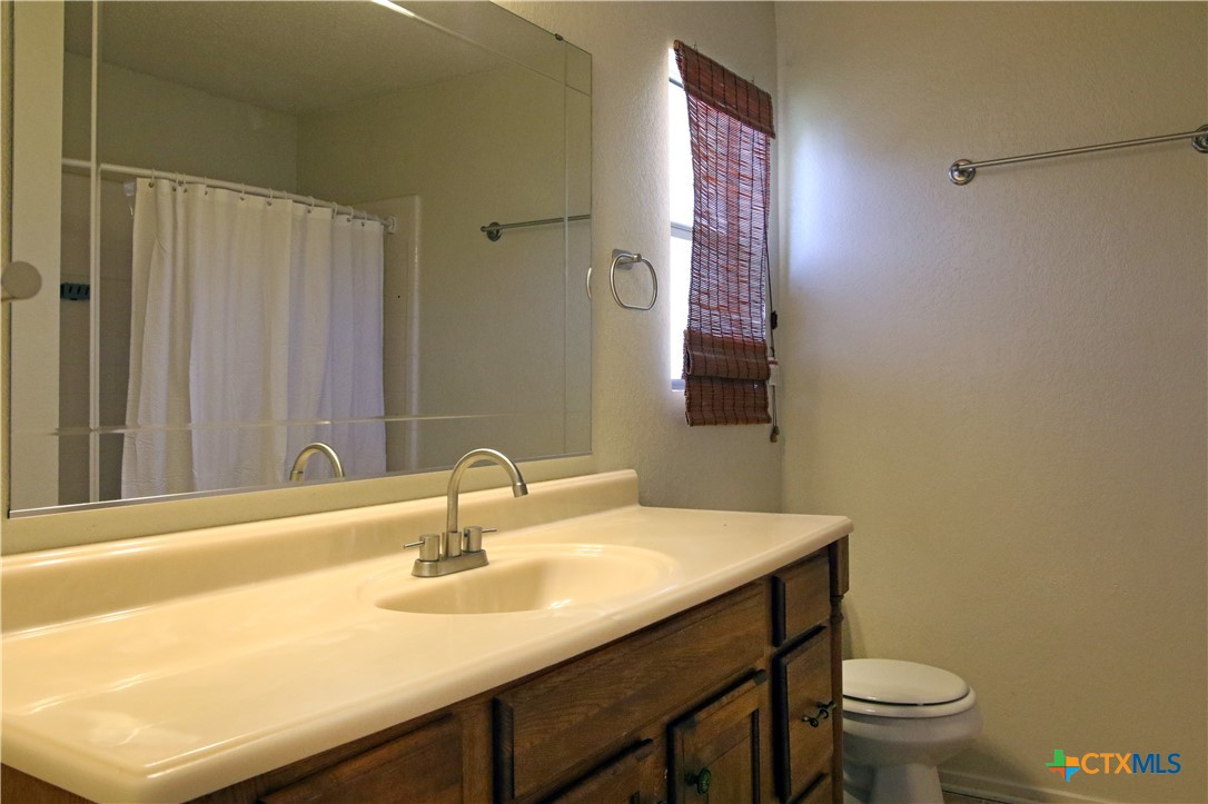 2406 Boyd Avenue Killeen, TX 76543 - Photo 17 of 22 a bathroom with a sink and a toilet