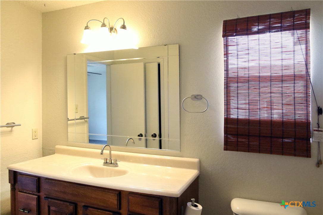 2406 Boyd Avenue Killeen, TX 76543 - Photo 19 of 22 a bathroom with a sink a toilet and shower