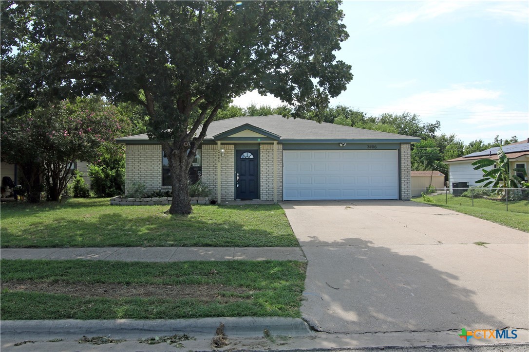 2406 Boyd Avenue Killeen, TX 76543 - Photo 2 of 22 a front view of a house with a garden
