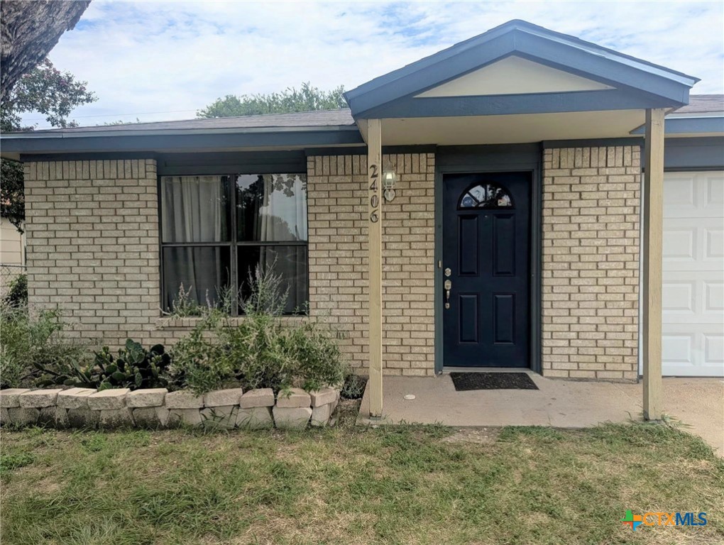 2406 Boyd Avenue Killeen, TX 76543 - Photo 3 of 22 a front view of a house with garden