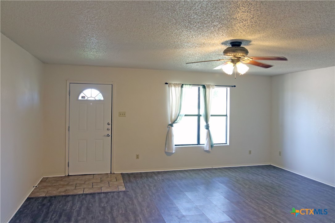 2406 Boyd Avenue Killeen, TX 76543 - Photo 4 of 22 a view of an empty room with window and wooden floor