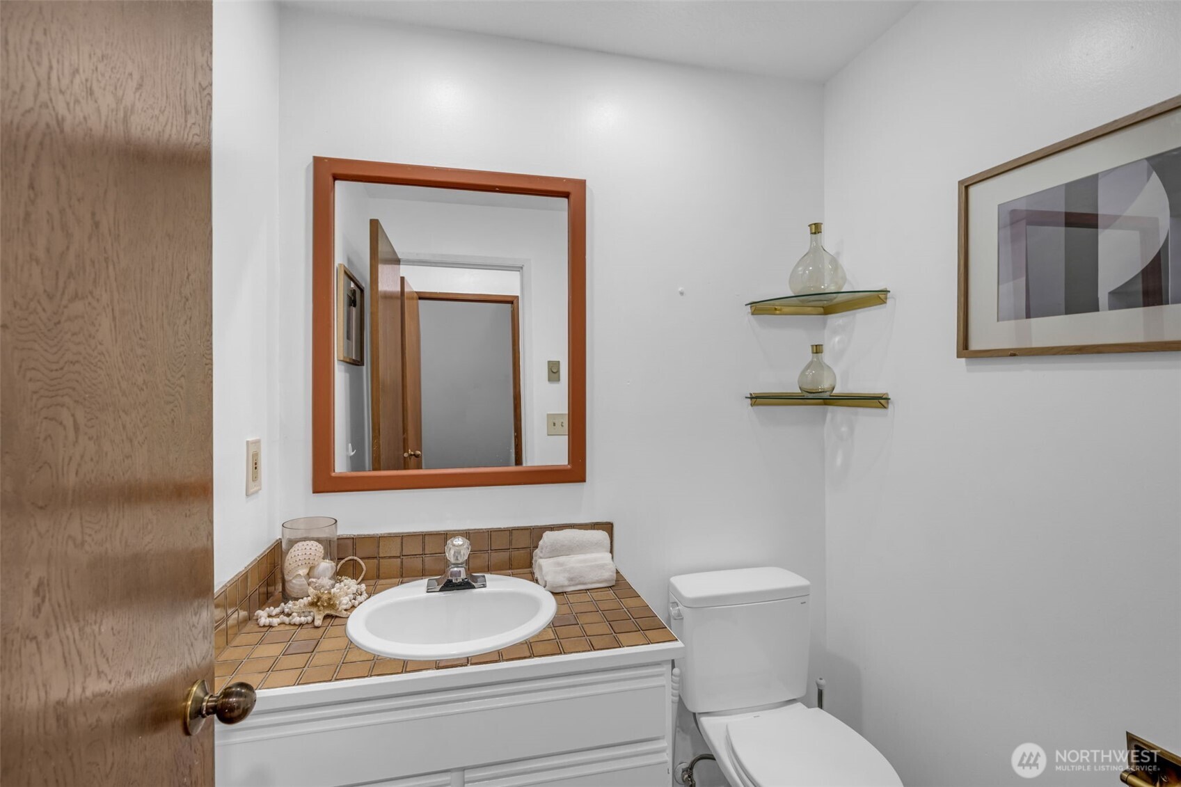 816 North 175th Street, Unit 2 Shoreline, WA 98133 - Photo 16 of 40 a bathroom with a toilet sink and mirror