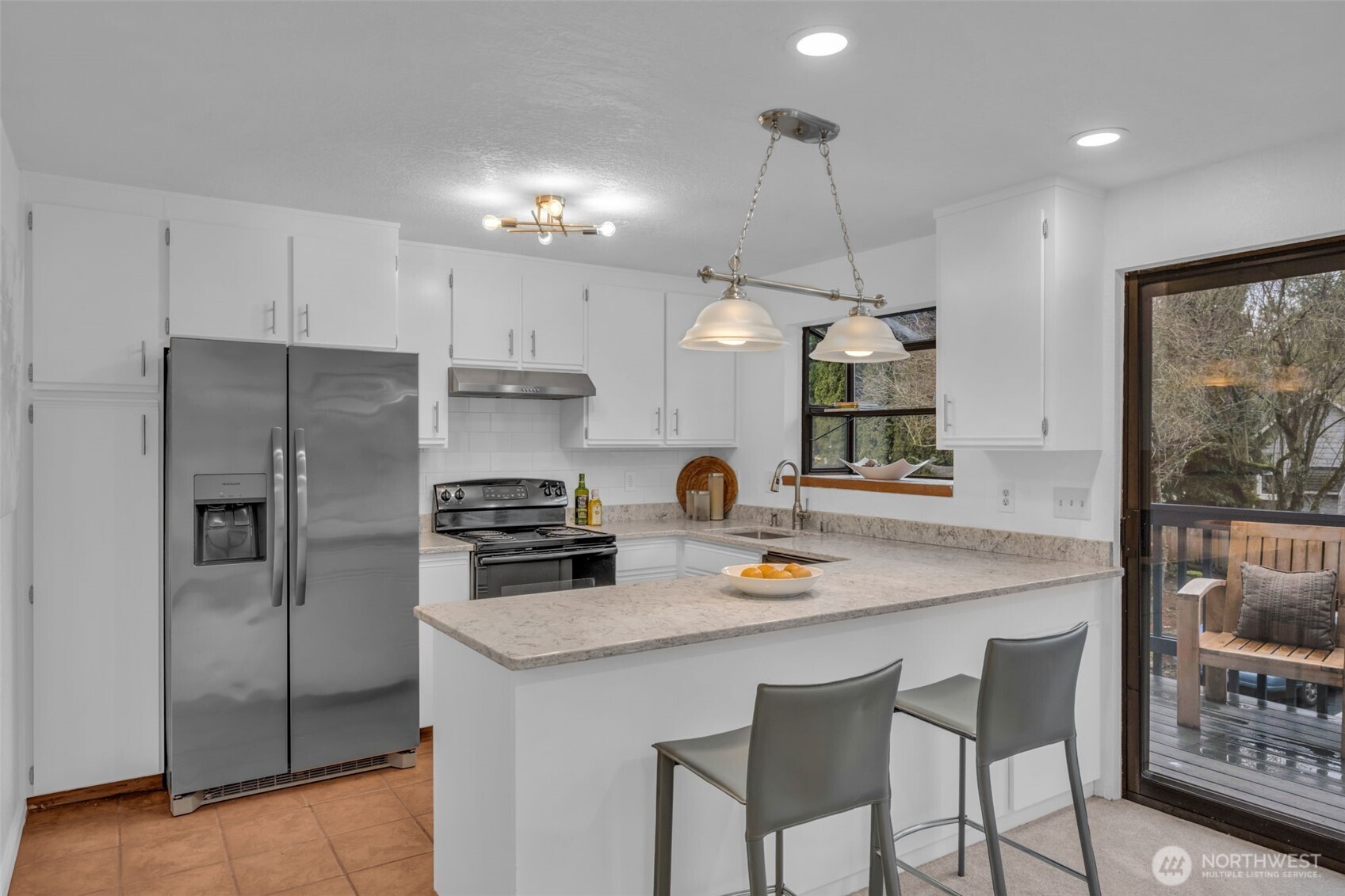 816 North 175th Street, Unit 2 Shoreline, WA 98133 - Photo 19 of 40 a kitchen with refrigerator cabinets and wooden floor
