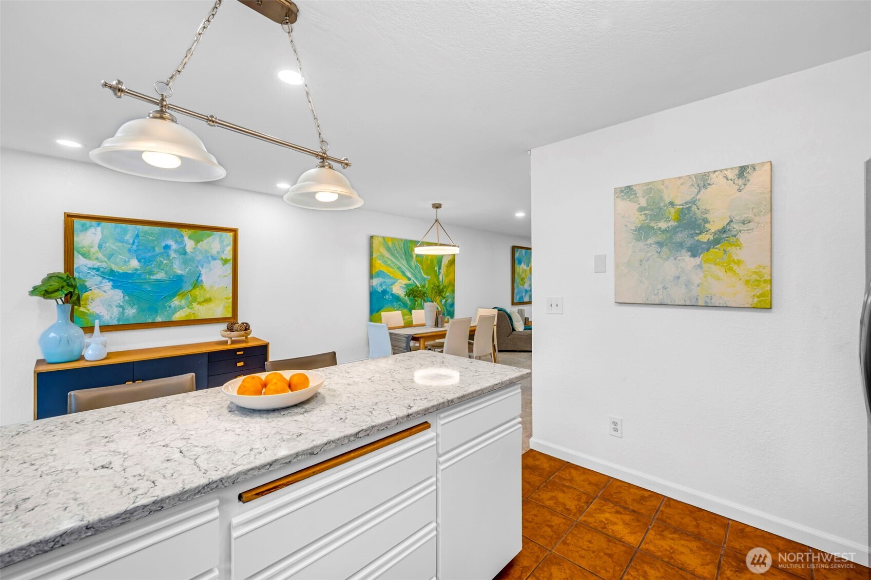 816 North 175th Street, Unit 2 Shoreline, WA 98133 - Photo 24 of 40 a kitchen with stainless steel appliances granite countertop a stove a sink and a wooden floor with chandelier