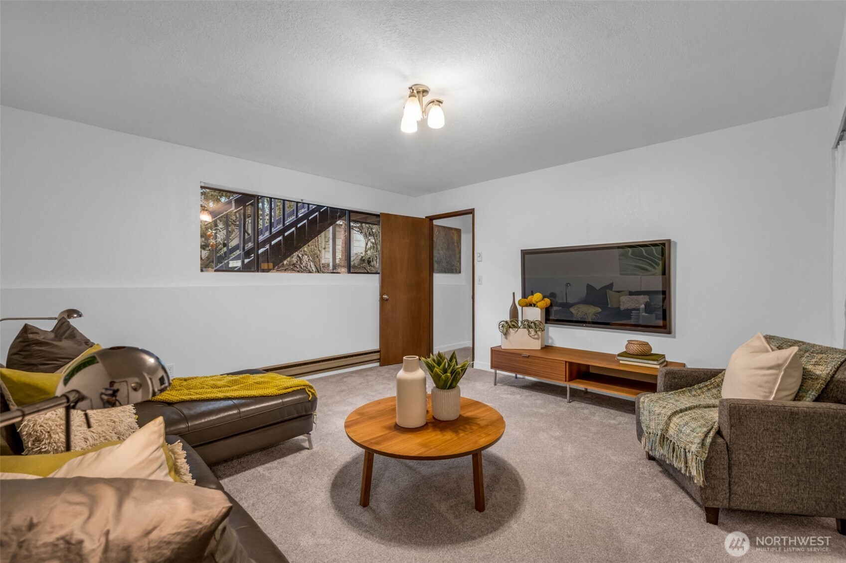 816 North 175th Street, Unit 2 Shoreline, WA 98133 - Photo 38 of 40 a living room with furniture and a flat screen tv