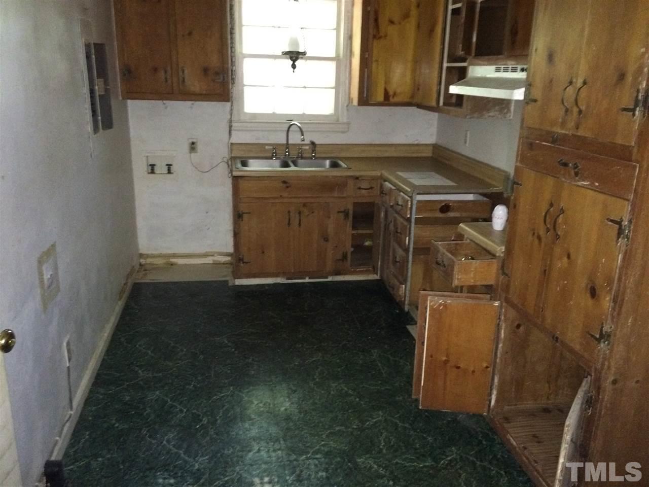 3129 Ward Road Raleigh, NC 27604 - Photo 5 of 9 a utility room with a sink a washer and dryer
