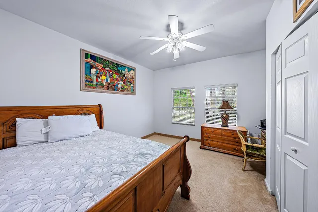 a bathroom with a sink a toilet and shower curtain
