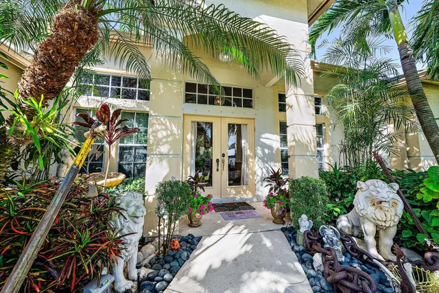 a kitchen with a sink window and cabinets