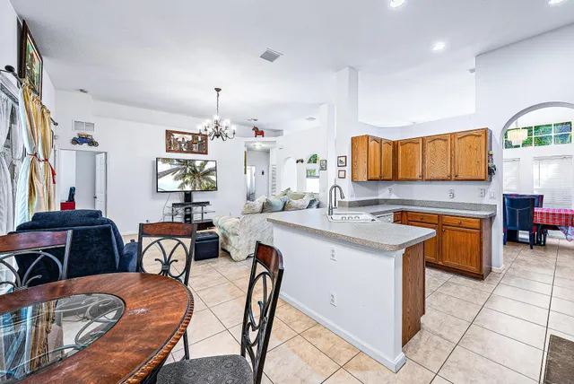a kitchen with stainless steel appliances granite countertop a sink and a microwave