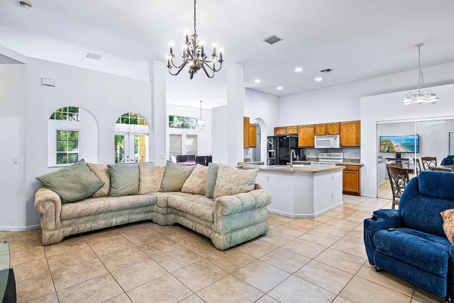 a room with pool table and window