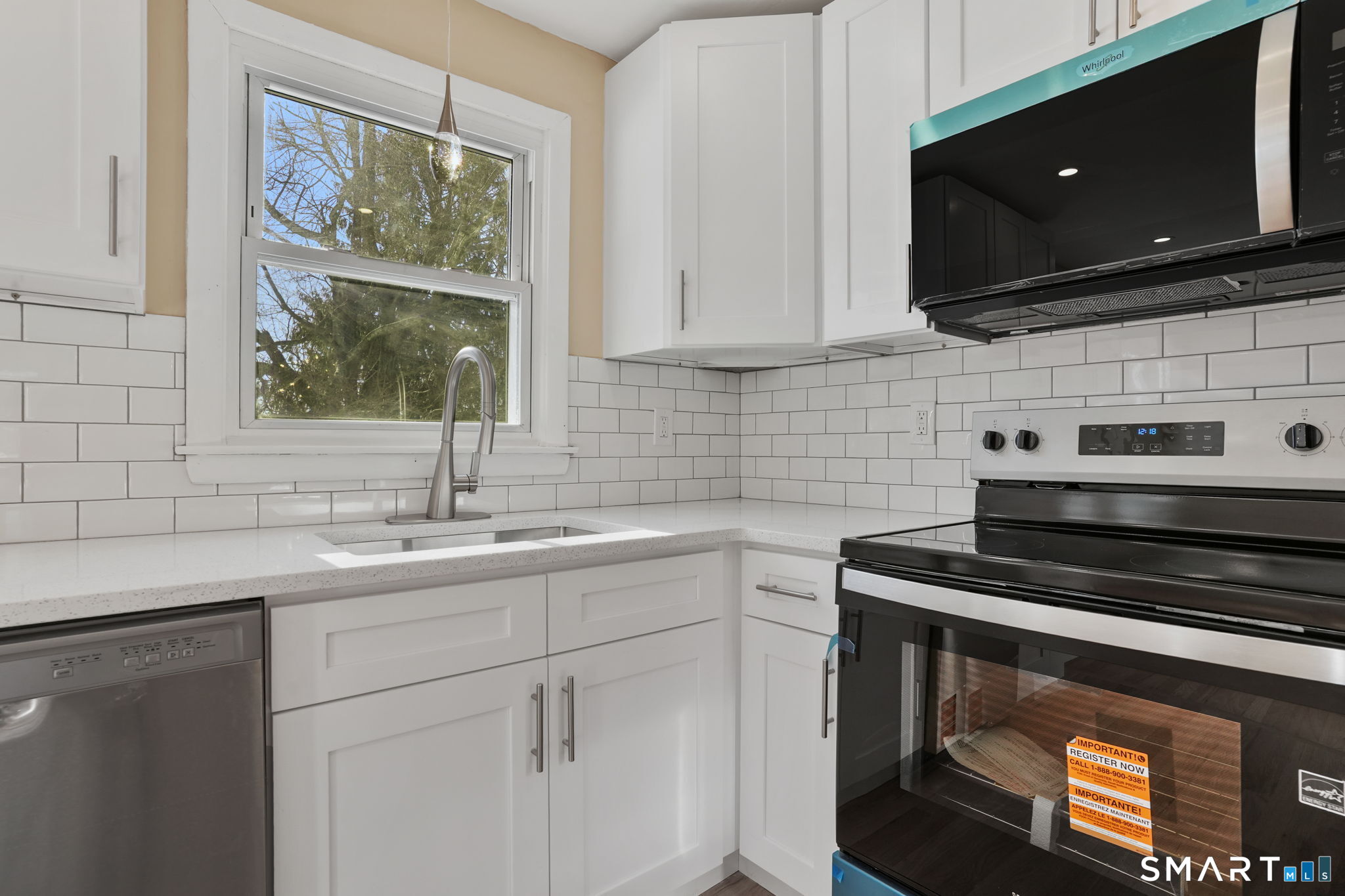 1 Winfield Avenue Wolcott, CT 06716 - Photo 13 of 38 a kitchen with stainless steel appliances a stove sink and microwave