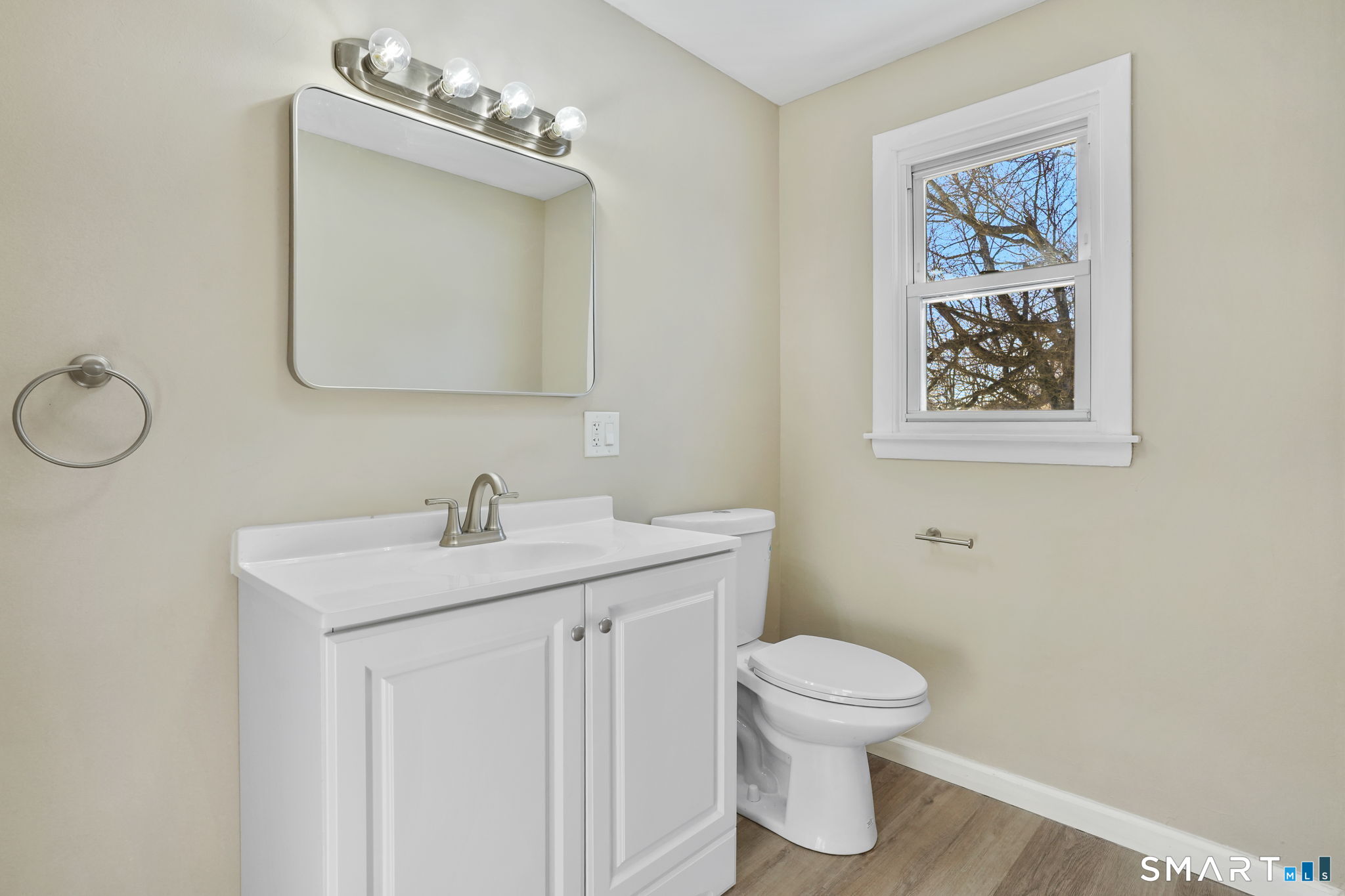 1 Winfield Avenue Wolcott, CT 06716 - Photo 20 of 38 a bathroom with a toilet a sink and mirror