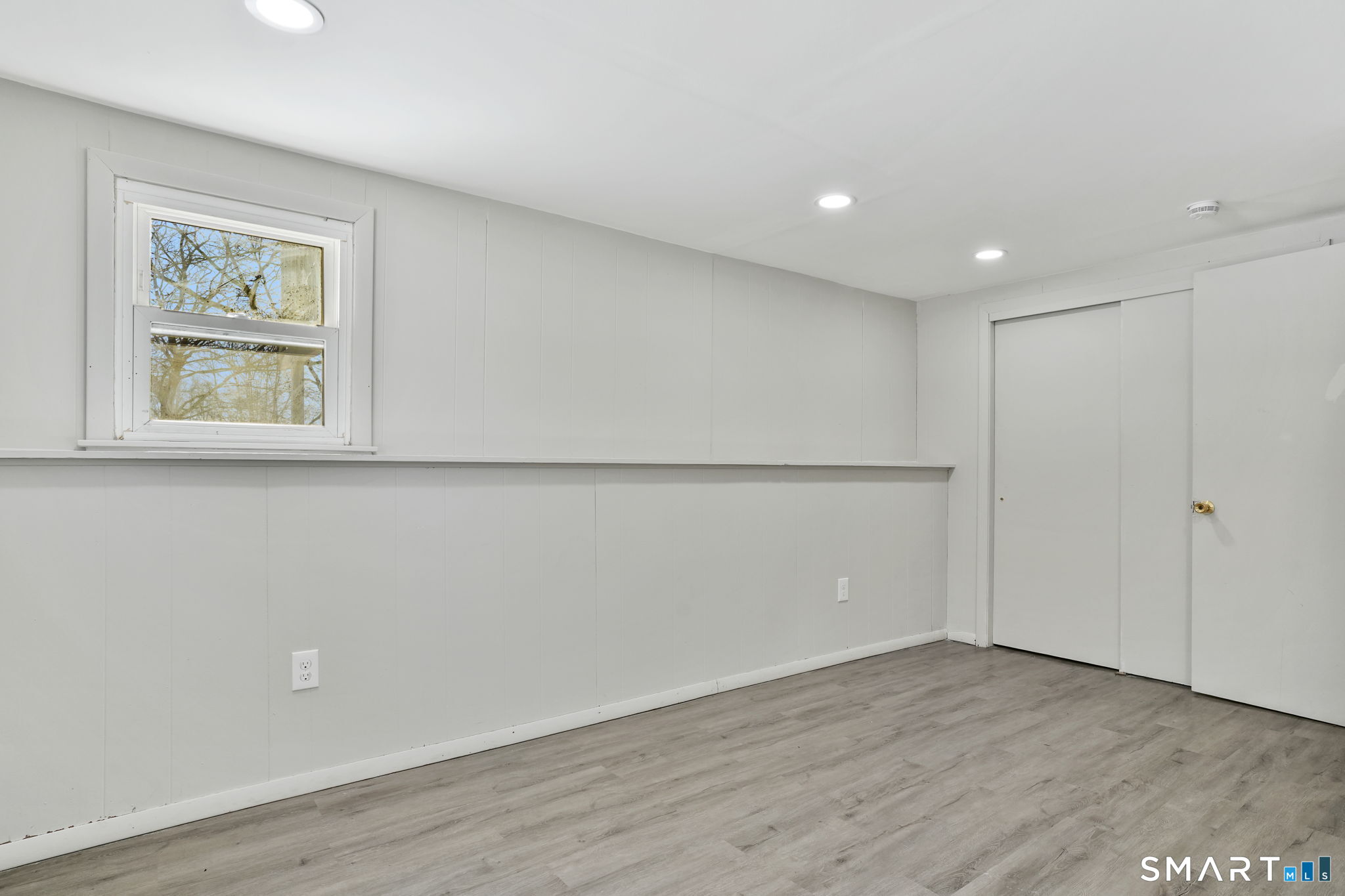 1 Winfield Avenue Wolcott, CT 06716 - Photo 27 of 38 a view of an empty room with wooden floor and a window