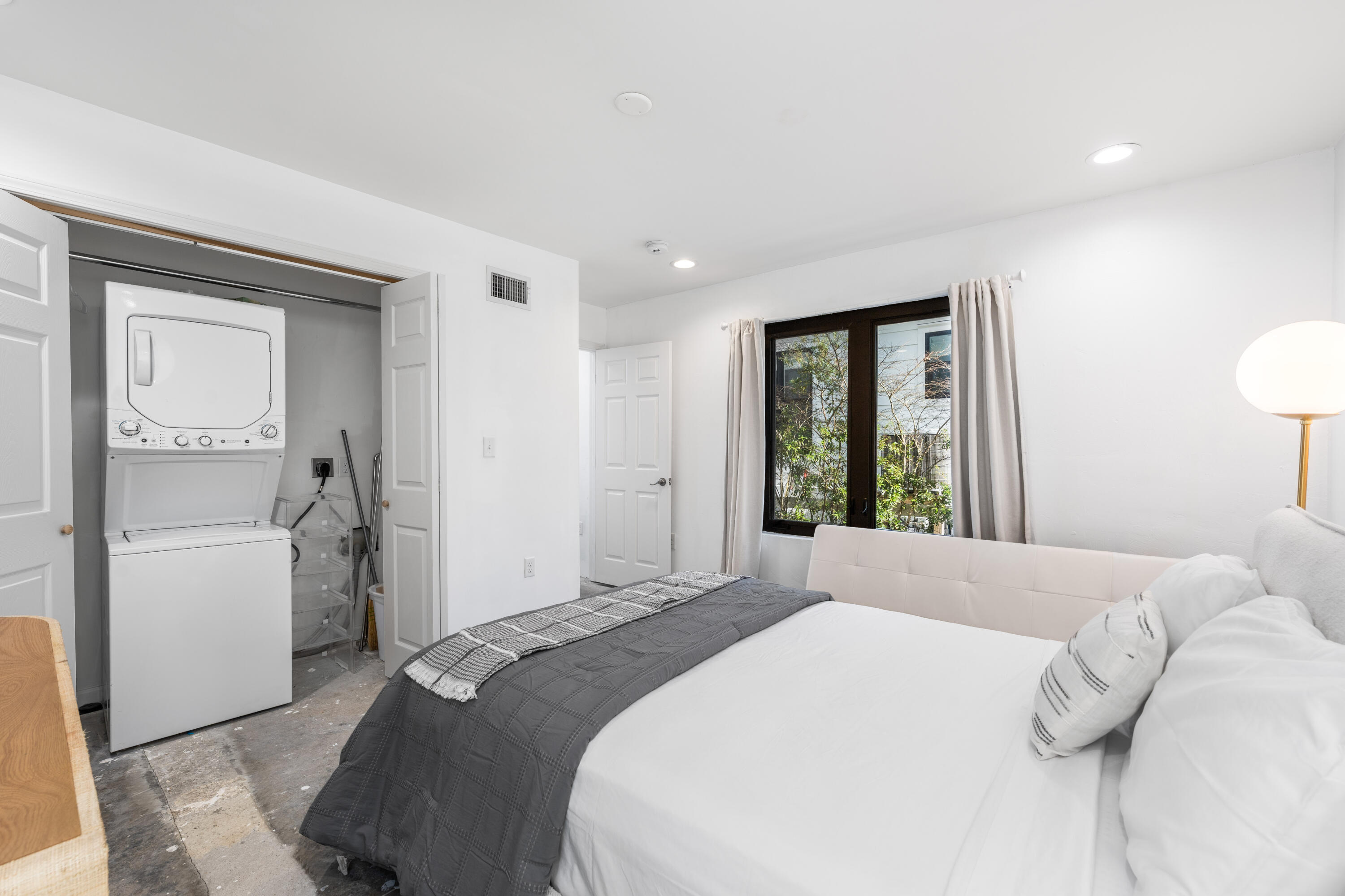 149 Native Tree Lane Santa Rosa Beach, FL 32459 - Photo 18 of 52 a bedroom with a bed and a large window