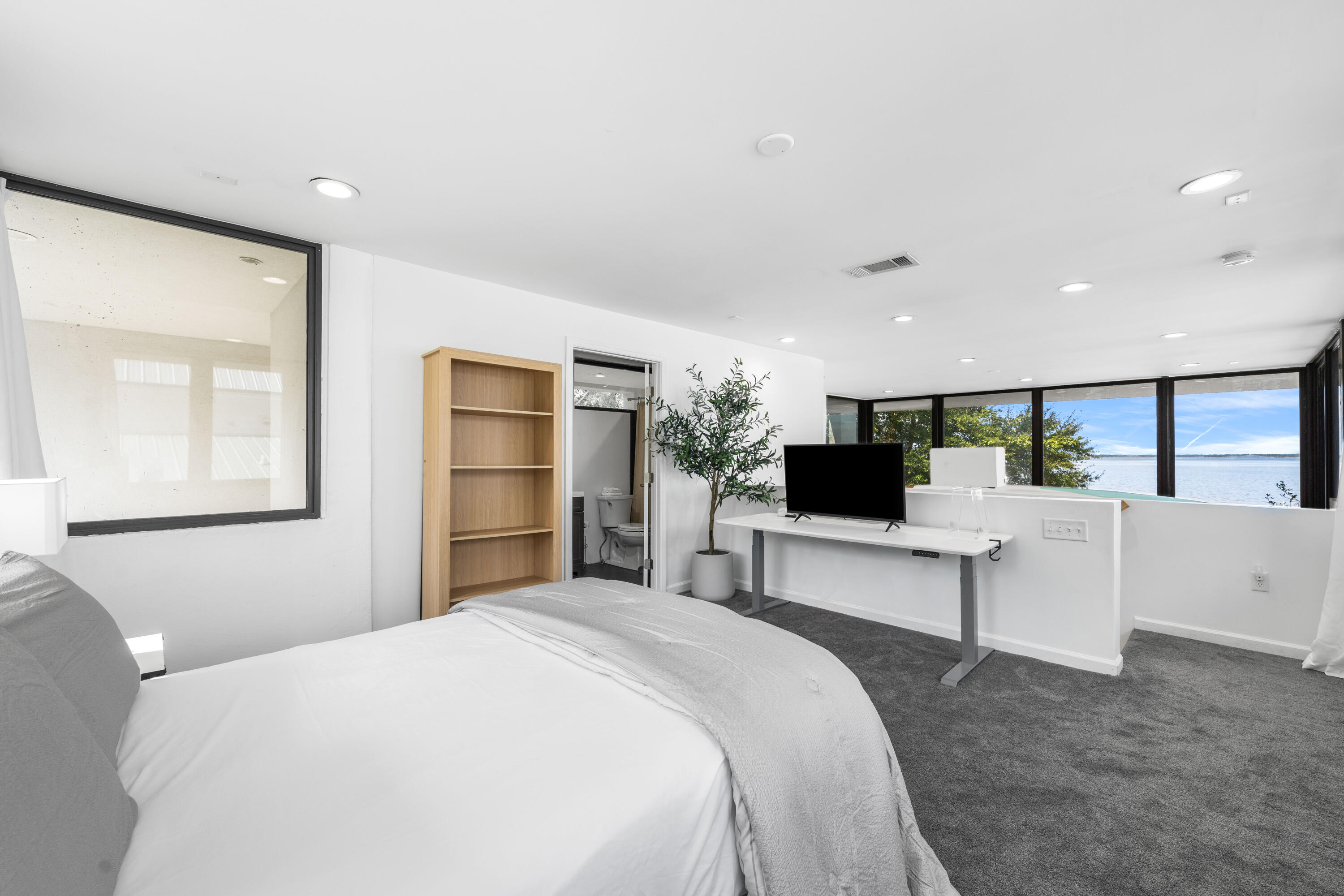 149 Native Tree Lane Santa Rosa Beach, FL 32459 - Photo 23 of 52 a bedroom with a large bed and a flat screen tv