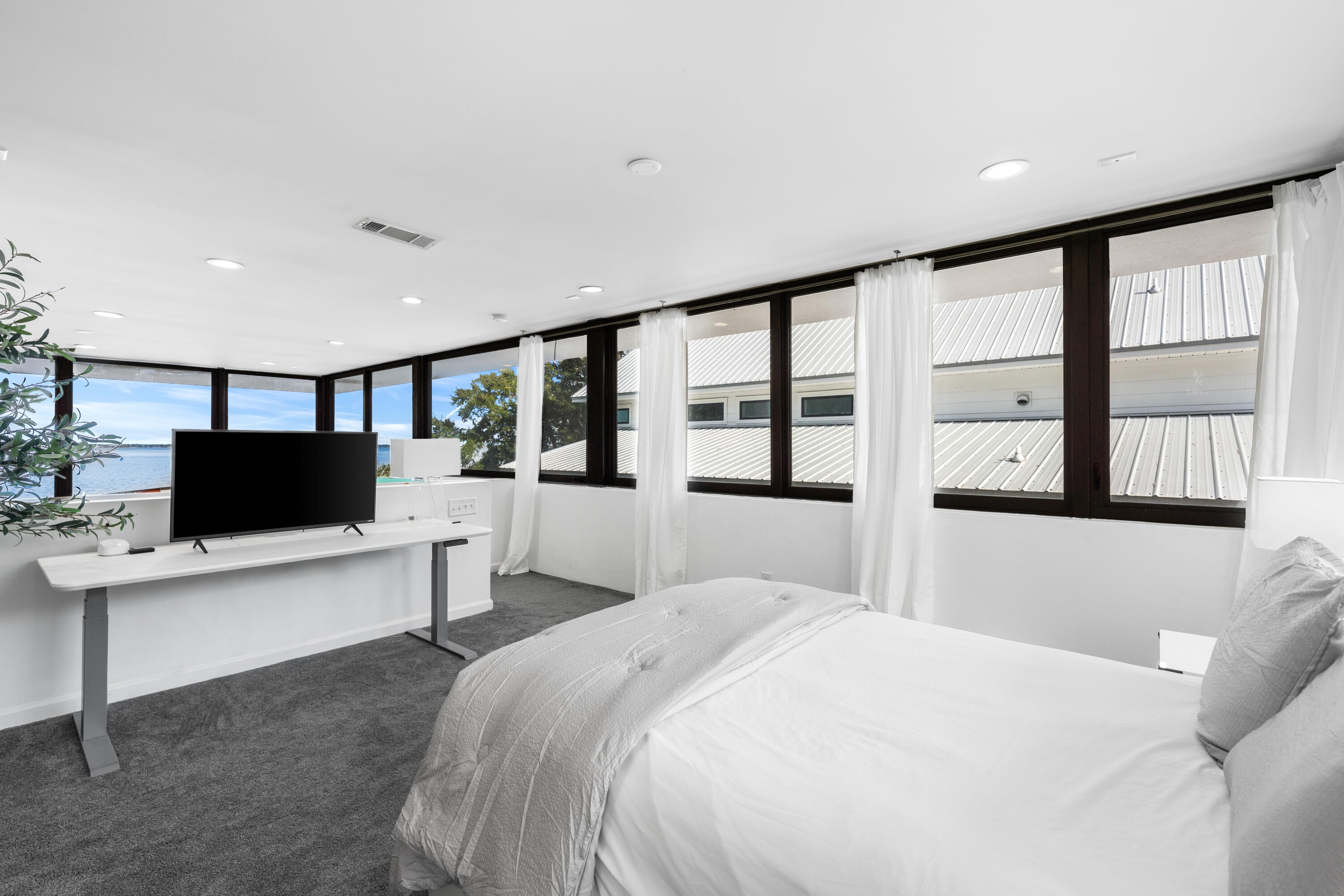 149 Native Tree Lane Santa Rosa Beach, FL 32459 - Photo 24 of 52 a large bedroom with a large bed and a flat screen tv