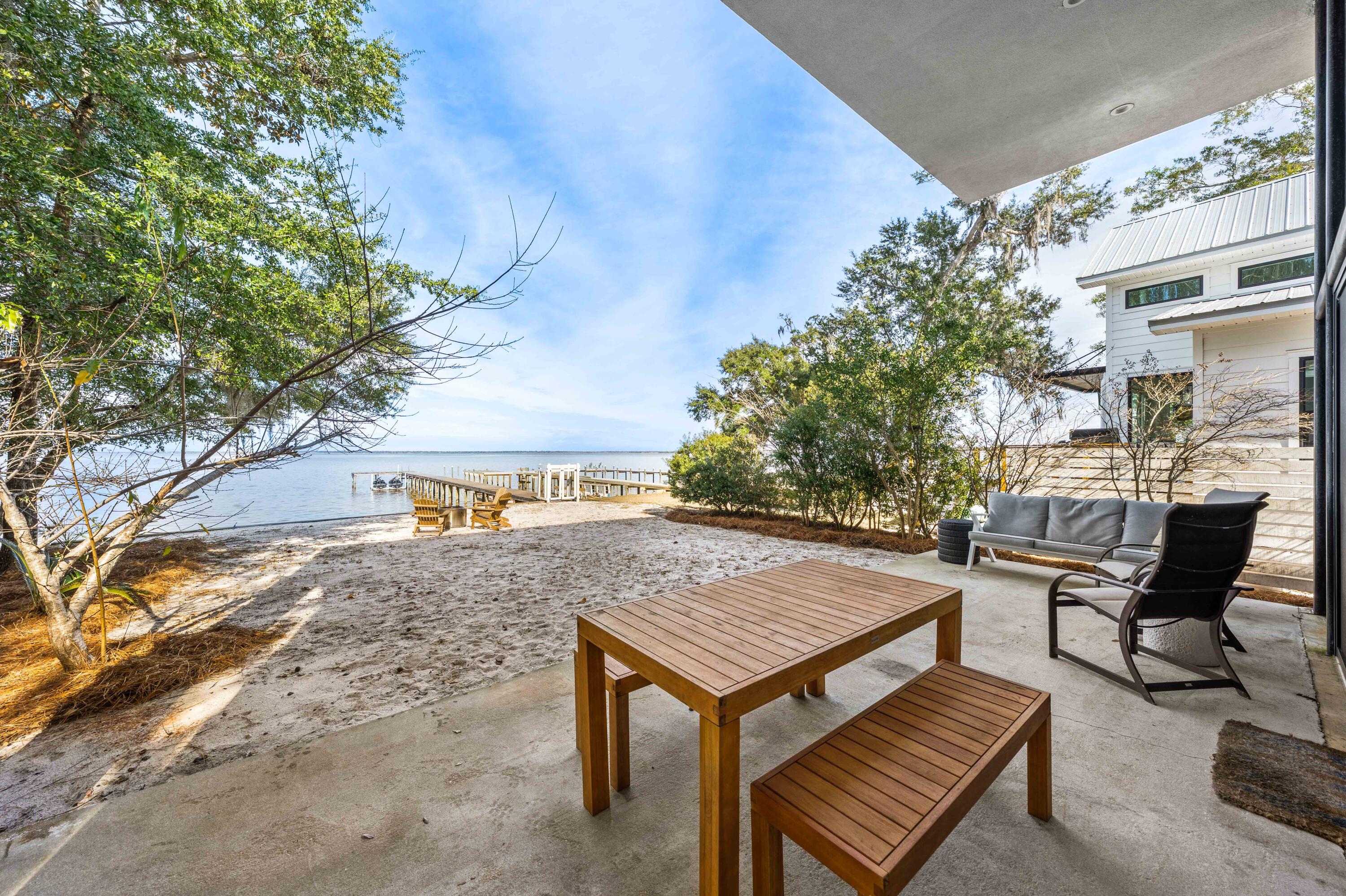 149 Native Tree Lane Santa Rosa Beach, FL 32459 - Photo 28 of 52 a view of a backyard with sitting area