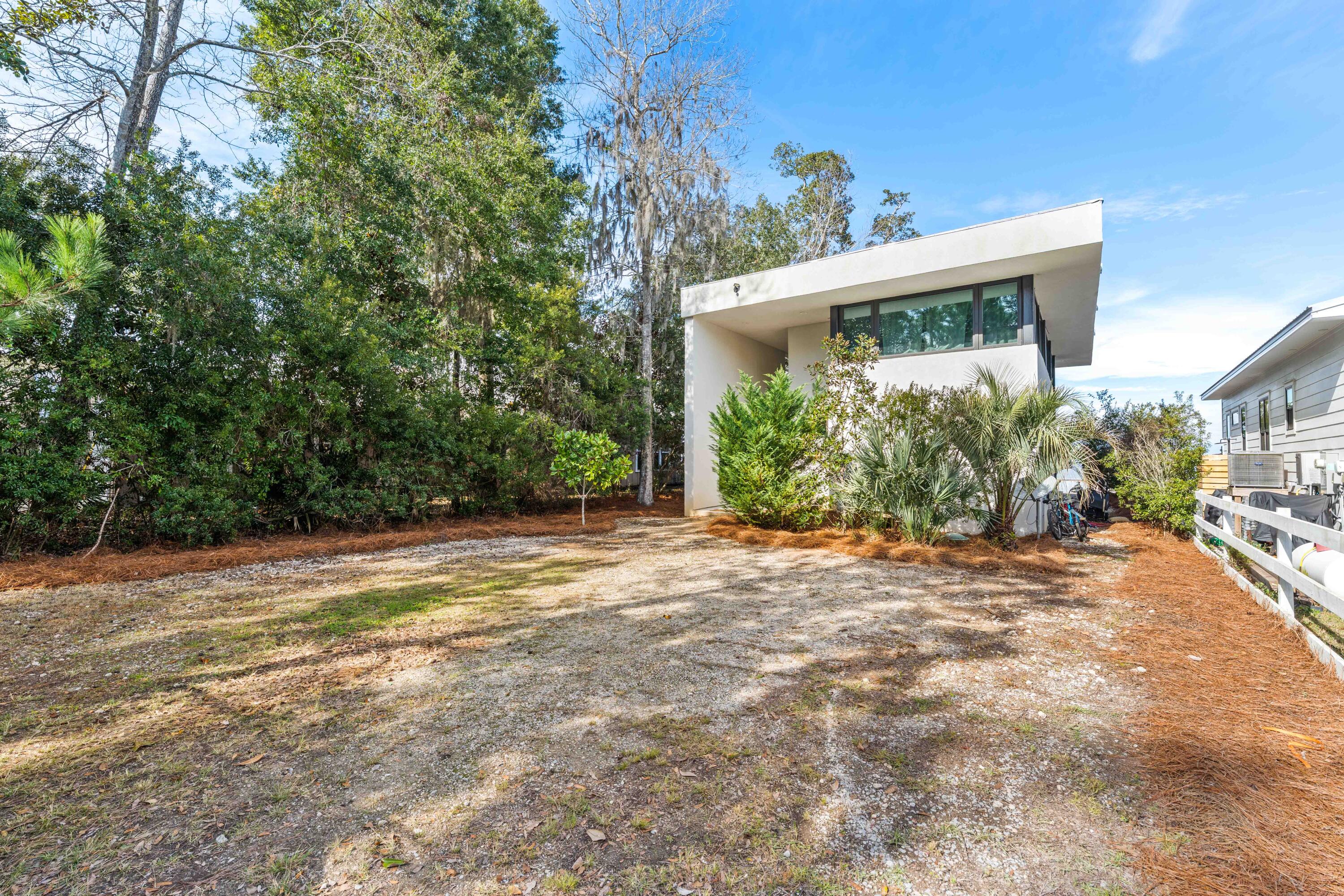 149 Native Tree Lane Santa Rosa Beach, FL 32459 - Photo 7 of 52 a view of a house with a yard