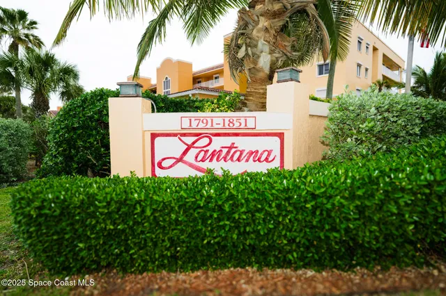 a sign that is on a brick wall