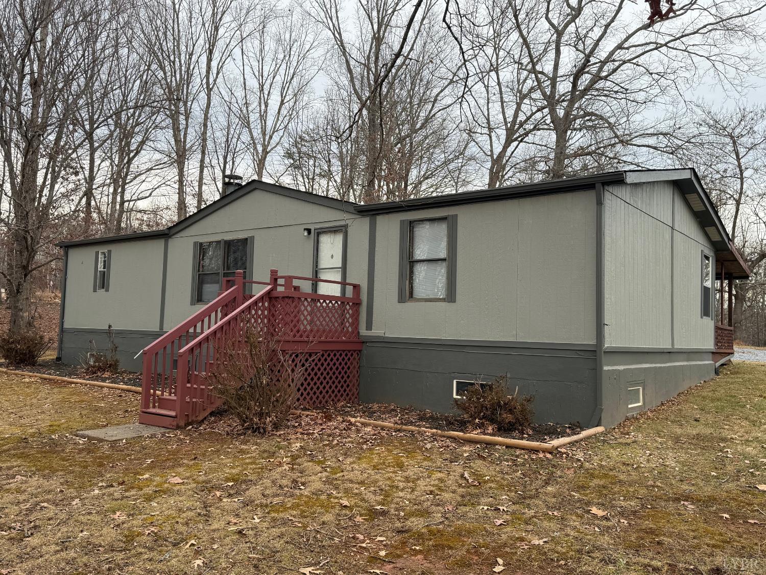 a view of a house with a yard covered with snow