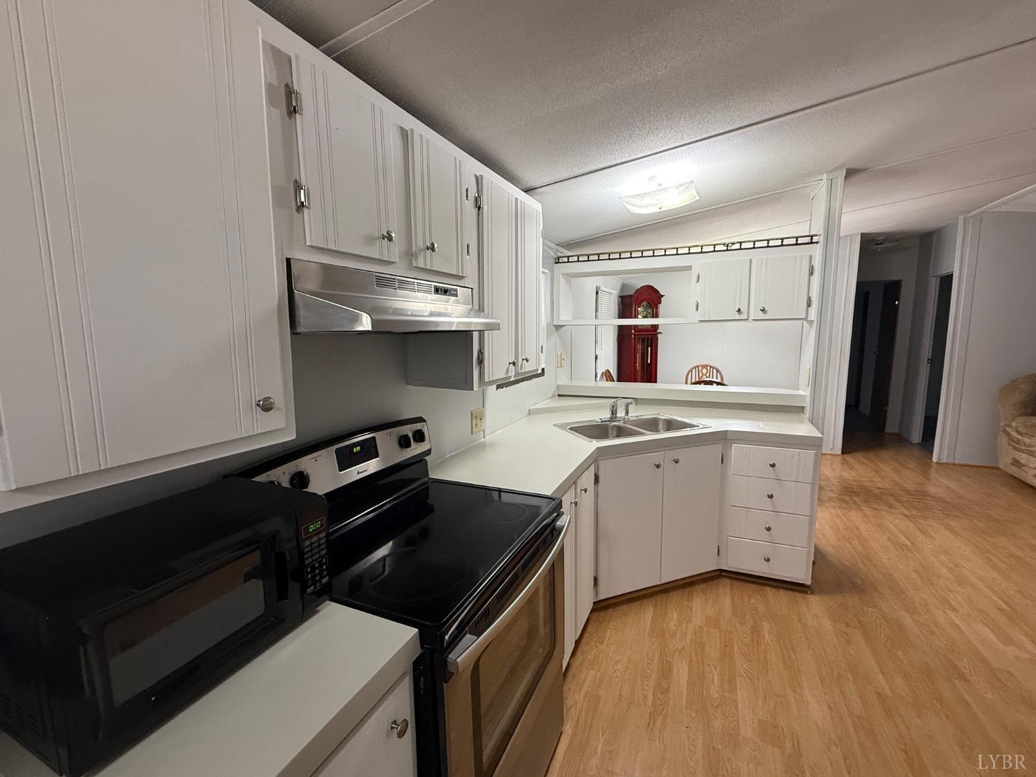 271 Candlemakers Lane Rustburg, VA 24588 - Photo 14 of 31 a kitchen with a stove oven and a refrigerator