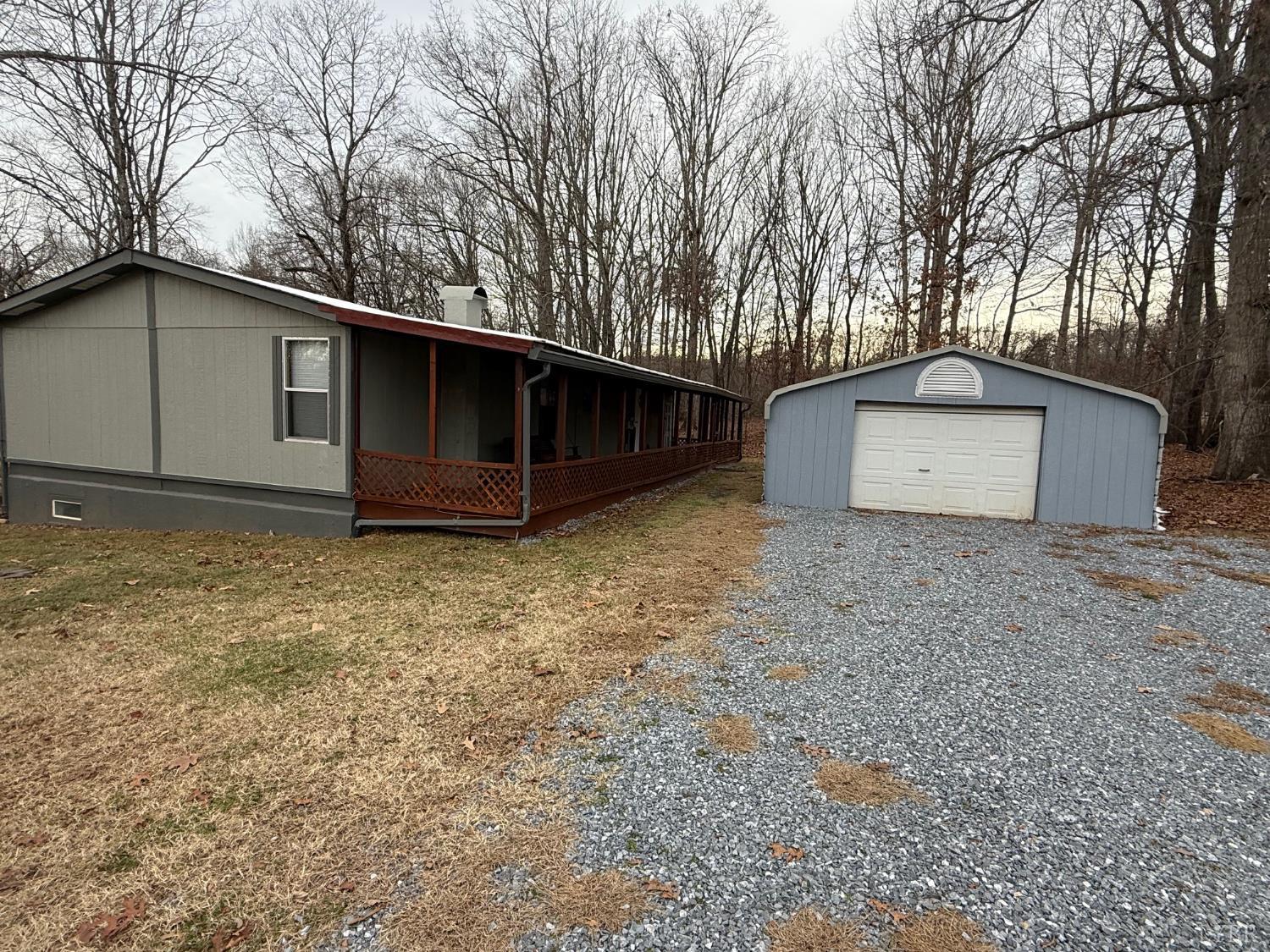 271 Candlemakers Lane Rustburg, VA 24588 - Photo 2 of 31 a house with trees in the background