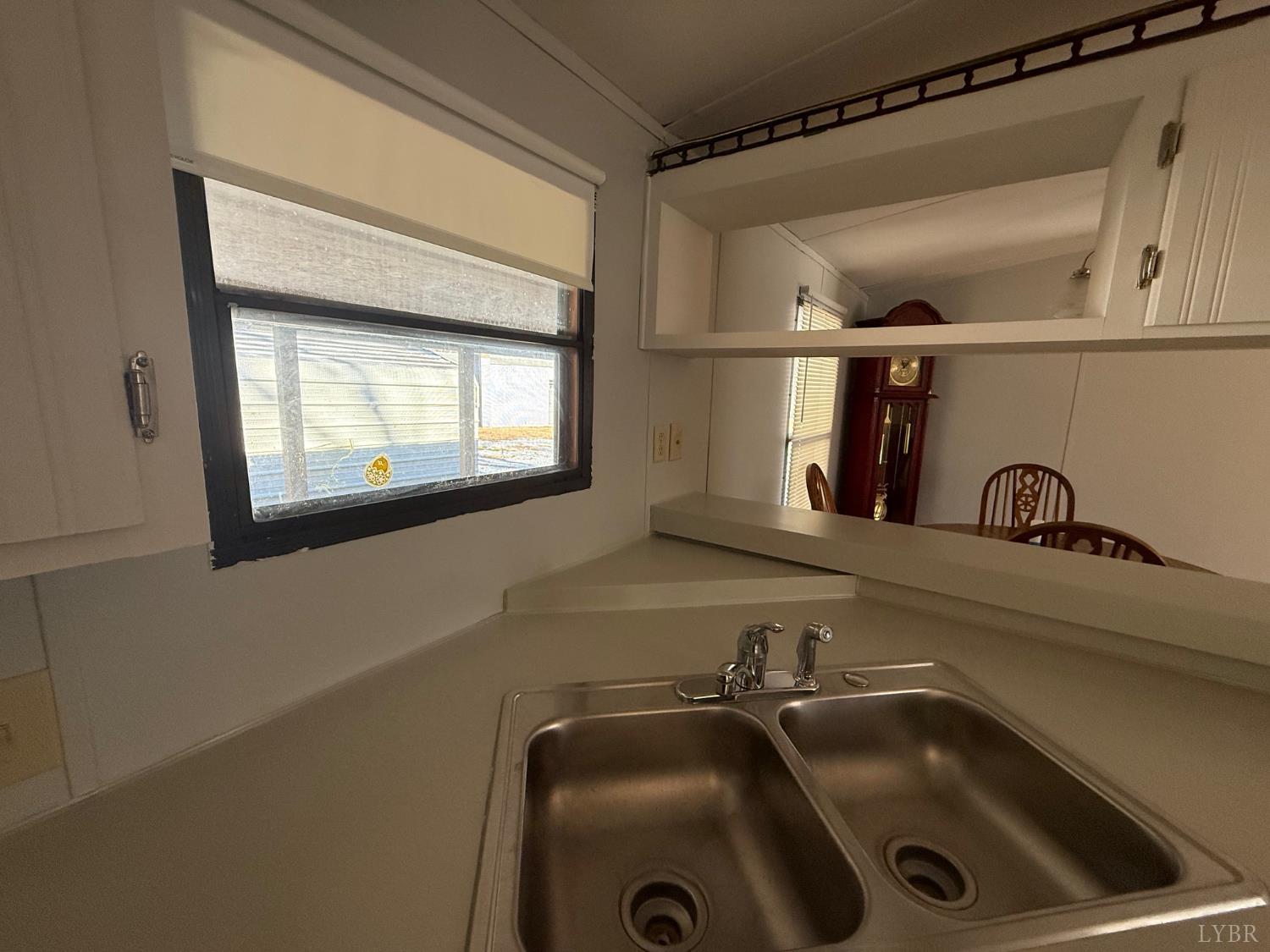 271 Candlemakers Lane Rustburg, VA 24588 - Photo 31 of 31 a bathroom with a sink and a mirror