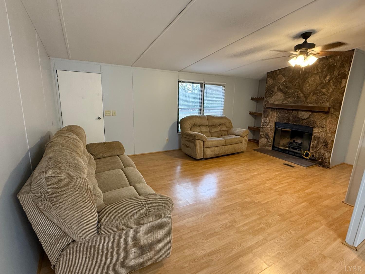 271 Candlemakers Lane Rustburg, VA 24588 - Photo 7 of 31 a living room with furniture and a fireplace
