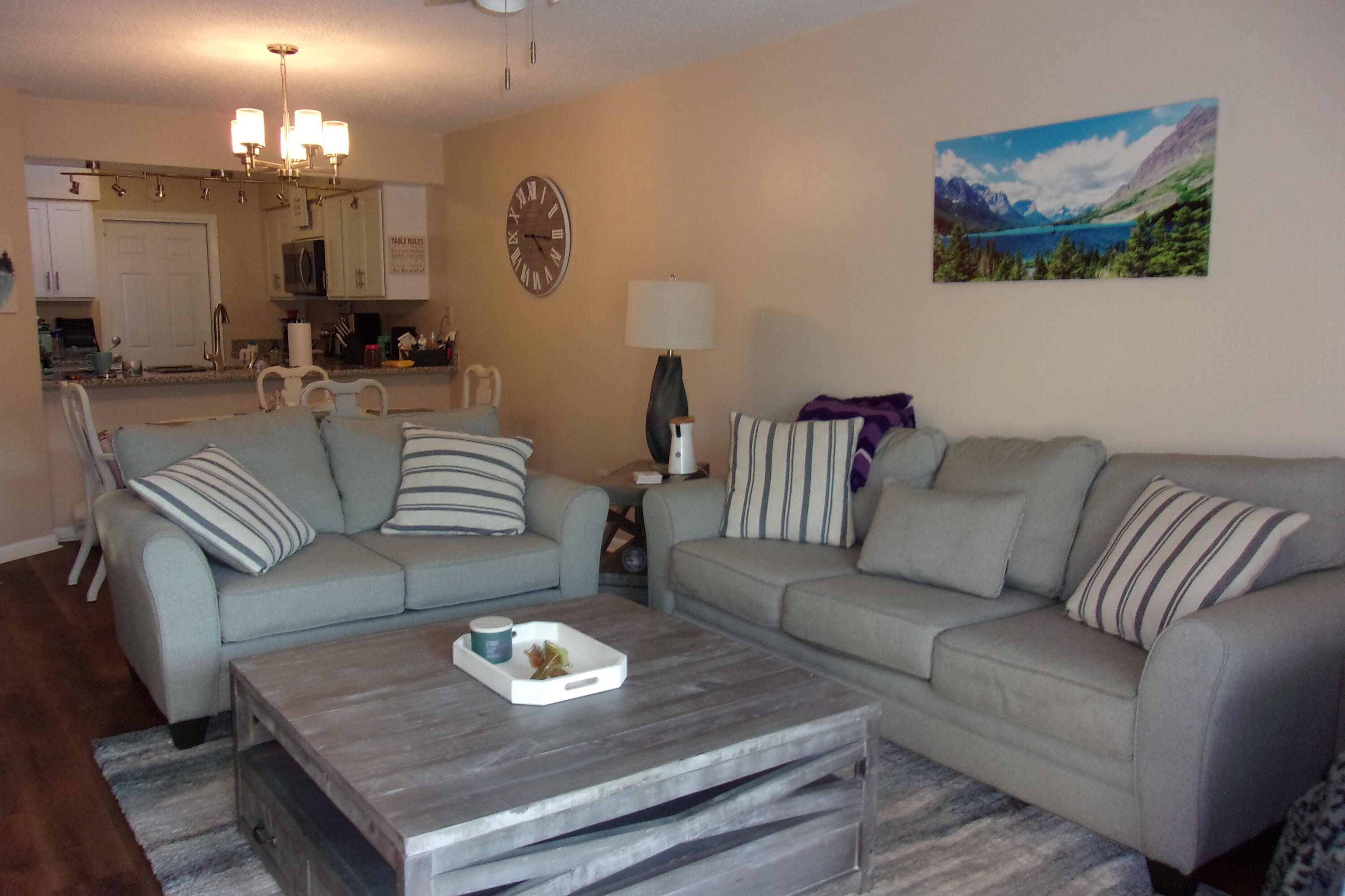 93 Cutter Lane Shalimar, FL 32579 - Photo 2 of 10 a living room with furniture and a chandelier