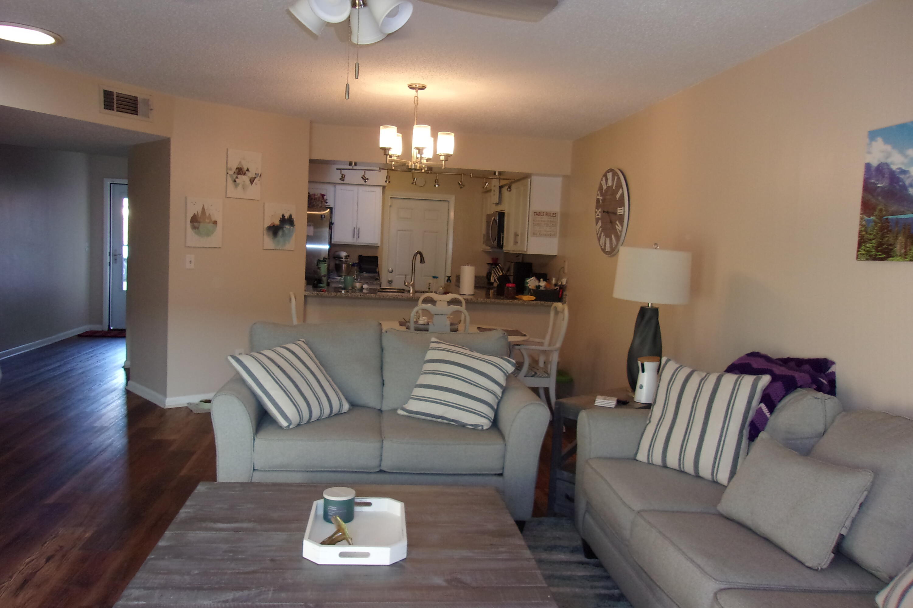 93 Cutter Lane Shalimar, FL 32579 - Photo 3 of 10 a living room with furniture and a chandelier