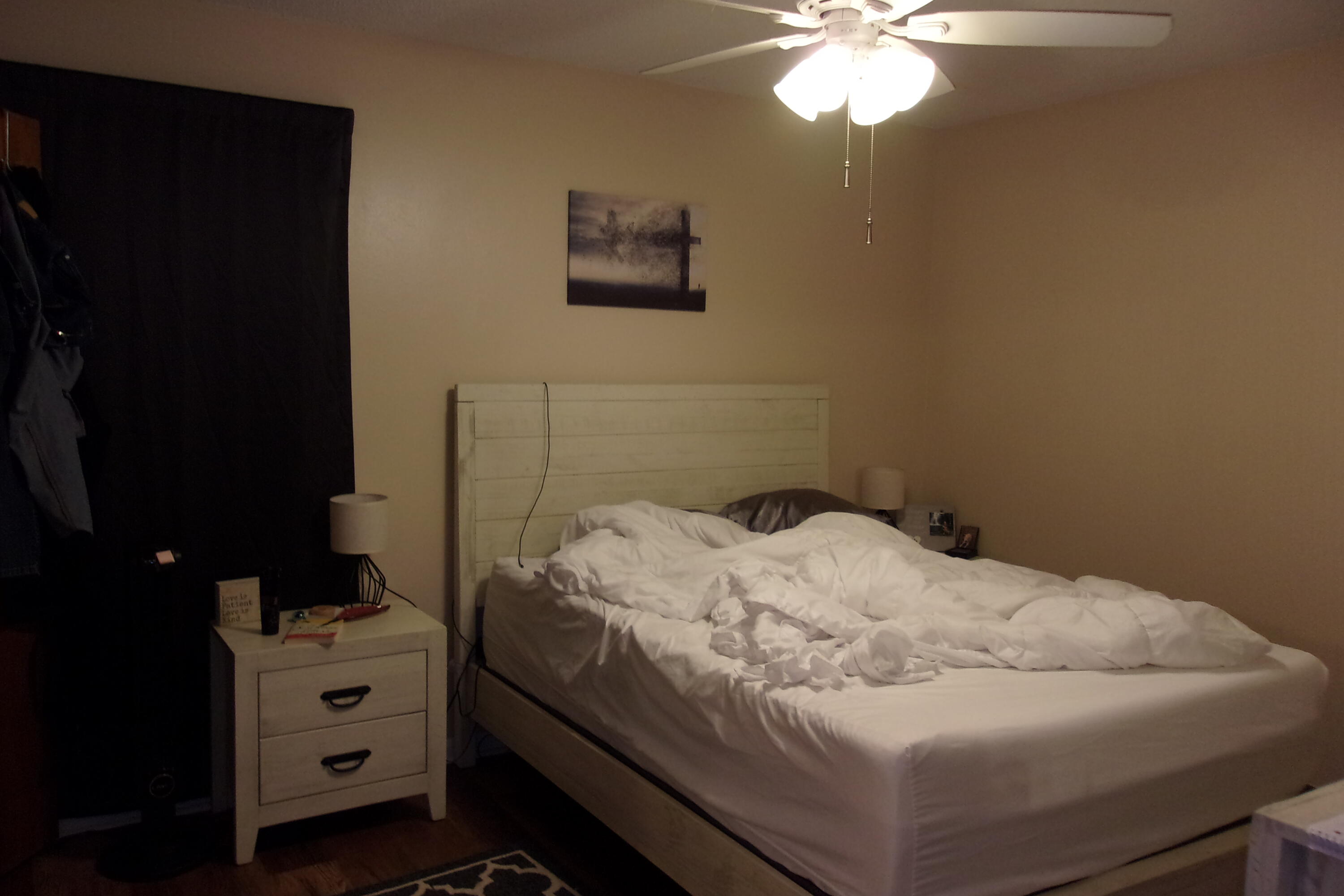 93 Cutter Lane Shalimar, FL 32579 - Photo 6 of 10 a bedroom with a bed and a chandelier