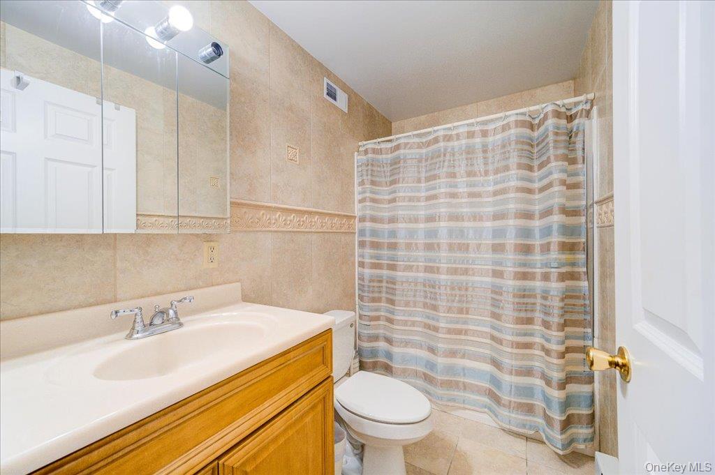 236 Budd Road Wurtsboro, NY 12790 - Photo 13 of 42 a bathroom with a sink toilet vanity and shower