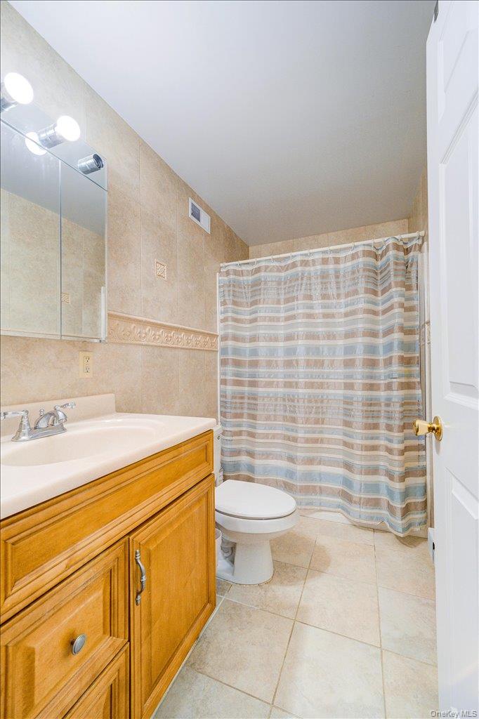 236 Budd Road Wurtsboro, NY 12790 - Photo 14 of 42 a bathroom with a sink a toilet and a shower