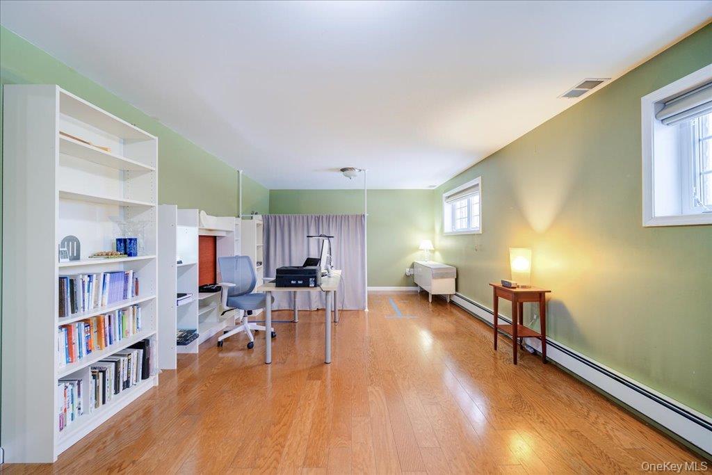 236 Budd Road Wurtsboro, NY 12790 - Photo 15 of 42 a living room with furniture and a book shelf