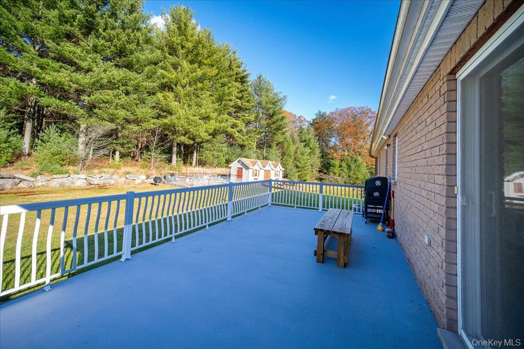 236 Budd Road Wurtsboro, NY 12790 - Photo 18 of 42 a view of a porch with wooden fence and floor
