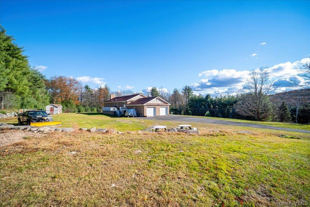 236 Budd Road Wurtsboro, NY 12790 - Photo 20 of 42 a view of a house with pool and a yard