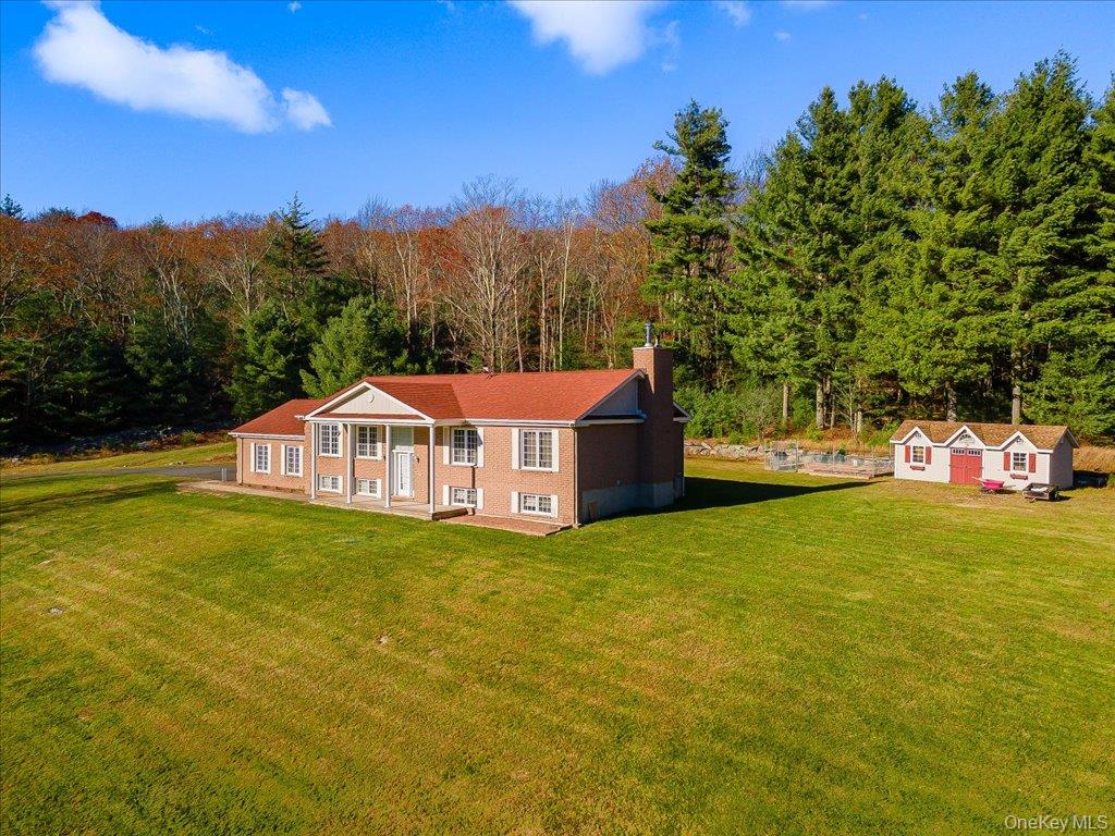 236 Budd Road Wurtsboro, NY 12790 - Photo 3 of 42 a view of a house with a yard and sitting area