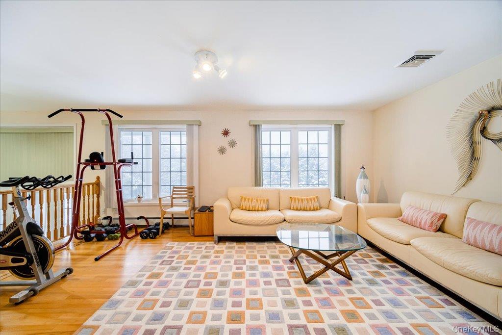 236 Budd Road Wurtsboro, NY 12790 - Photo 6 of 42 a living room with furniture and a floor to ceiling window