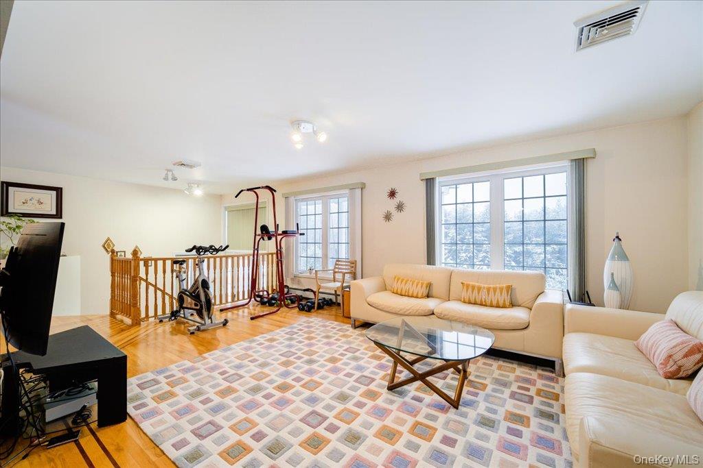 236 Budd Road Wurtsboro, NY 12790 - Photo 7 of 42 a living room with furniture and a flat screen tv