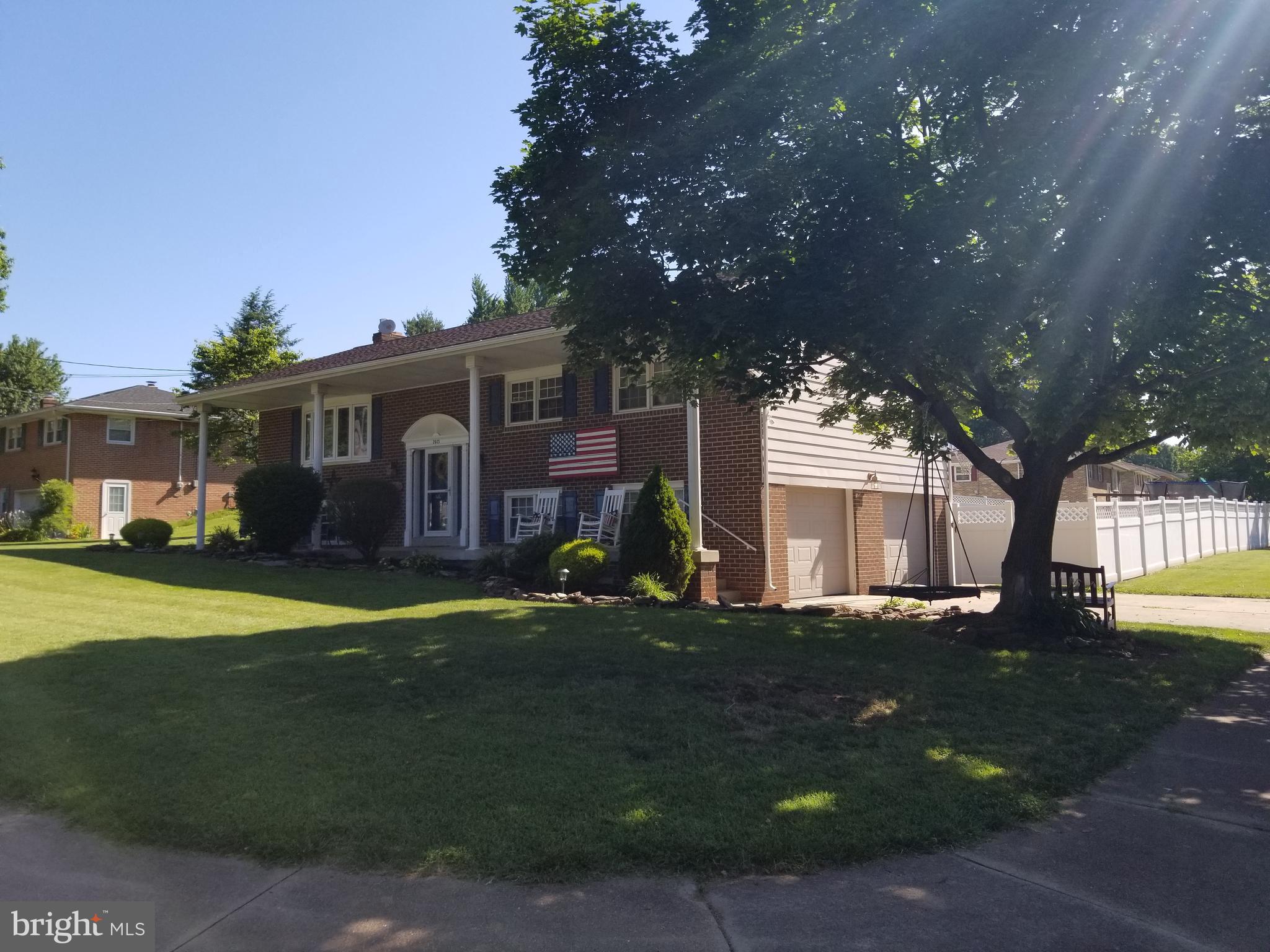 2025 Derry Road York, PA 17408 - Photo 2 of 45 a front view of a house with a garden and trees